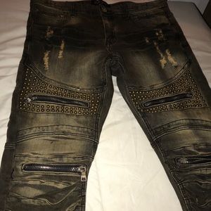 Blue Jean Pants With A Little Tan On Them